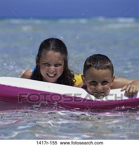 people, floating, water, beach, raft, friends, children View Large Photo Image Stock Photography - people, floating, water, beach, raft, friends, children. Fotosearch