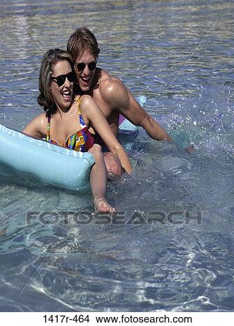 people, floating, water, smiling, couple, beach View Large Photo Image Picture - people, floating, water, smiling, couple, beach. Fotosearch