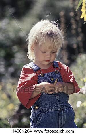 Picture - people, girl, outdoors, curious, child, blond, discovery. Fotosearch