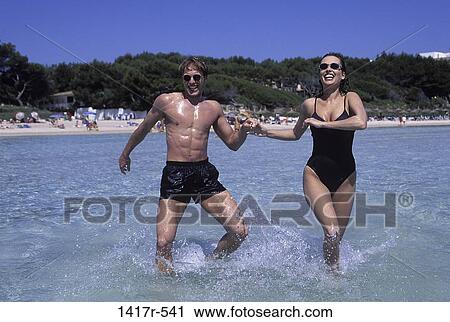 people, hands, playing, couple, beach, splash View Large Photo Image Stock Image - people, hands, playing, couple, beach, splash. Fotosearch