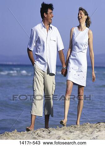 people, hands, walking, couple, happy, beach, laughing View Large Photo Image Stock Image - people, hands, walking, couple, happy, beach, laughing. Fotosearch