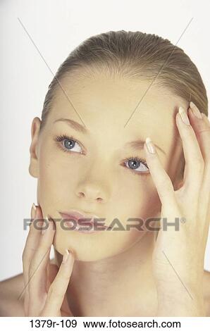 Stock Photo - people, hands, woman, blond, beauty, headshot. Fotosearch