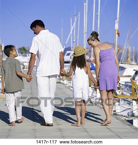 Stock Photo - people, Hispanic, outdoors, dock, family, brunette. Fotosearch