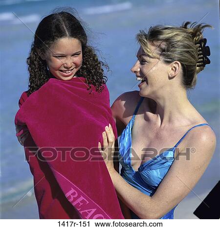 people, mother, wrapped, beach, laughing, cold, towel View Large Photo Image Stock Image - people, mother, wrapped, beach, laughing, cold, towel. Fotosearch