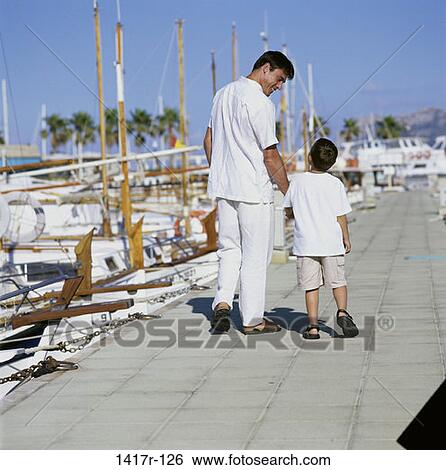 Stock Photograph - people, outdoors, boats, dock, family. Fotosearch