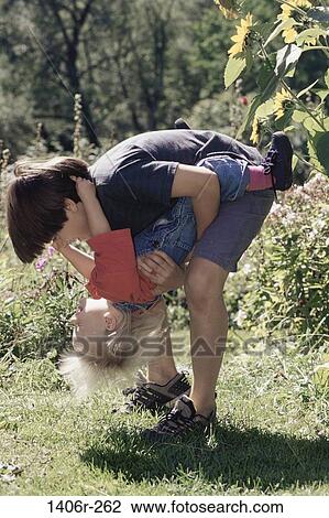 people, playing, laughing, playful, outdoors, children, play View Large Photo Image Stock Image - people, playing, laughing, playful, outdoors, children, play. Fotosearch