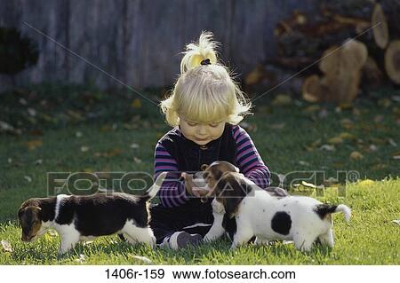 people, puppies, pet, girl, outdoors, child View Large Photo Image Stock Photo - people, puppies, pet, girl, outdoors, child. Fotosearch