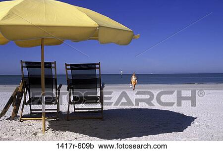 people, relaxation, woman, umbrella, beach, tide, relaxing View Large Photo Image Stock Image - people, relaxation, woman, umbrella, beach, tide, relaxing. Fotosearch