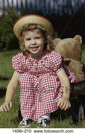 people, smiling, playing, hat, sitting, stuffed animal, girl View Large Photo Image Stock Image - people, smiling, playing, hat, sitting, stuffed animal, girl. Fotosearch