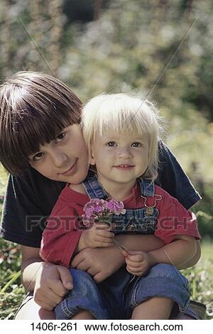 people, smiling, sitting, holding, flowers, outdoors, children View Large Photo Image Stock Image - people, smiling, sitting, holding, flowers, outdoors, children. Fotosearch