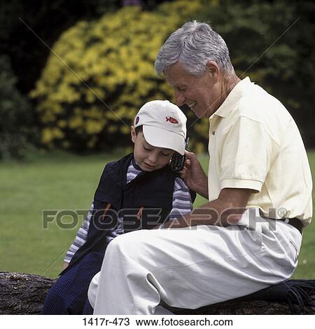 Stock Image - people, smiling, telephone, talking, listening, conversation, phone. Fotosearch