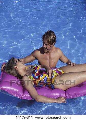 , people, swim, floating, water, pool, couple View Large Photo Image Stock Image - , people, swim, floating, water, pool, couple. Fotosearch