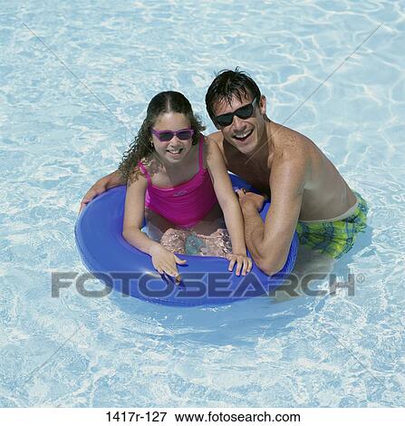 people, swim, pool, swimming, sunglasses, inner tube View Large Photo Image Stock Photo - people, swim, pool, swimming, sunglasses, inner tube. Fotosearch
