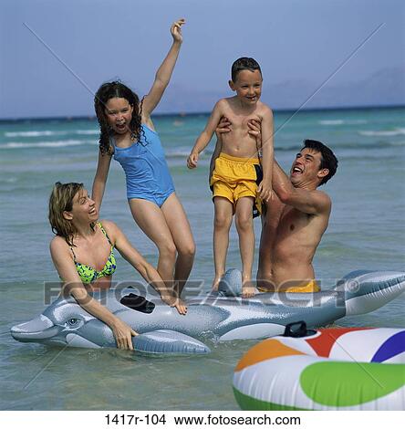 people, water, beach, family, parents View Large Photo Image Picture - people, water, beach, family, parents. Fotosearch