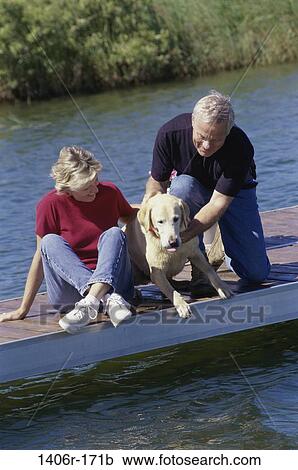 people, water, dog, couple, senior, pet, outdoors View Large Photo Image Stock Image - people, water, dog, couple, senior, pet, outdoors. Fotosearch