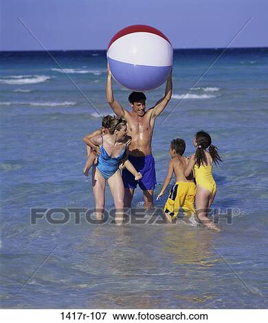 people, water, playing, beach, family, play View Large Photo Image Stock Photo - people, water, playing, beach, family, play. Fotosearch