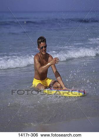 people, water, playing, beach, splash, sunglasses View Large Photo Image Stock Photograph - people, water, playing, beach, splash, sunglasses. Fotosearch