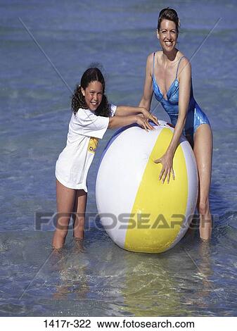 people, water, playing, mother, ball, beach, square View Large Photo Image Stock Image - people, water, playing, mother, ball, beach, square. Fotosearch
