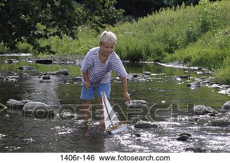 Stock Photograph - people, water, playing, stream, boy, outdoors. Fotosearch