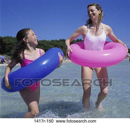 people, water, running, playing, mother, beach, playful View Large Photo Image Stock Image - people, water, running, playing, mother, beach, playful. Fotosearch
