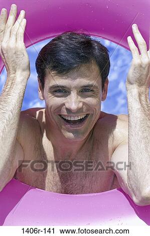 Stock Image - people, water, smiling, beach, inner tube, smile. Fotosearch