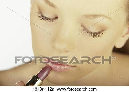 people, woman, lipstick, beauty, cosmetics, indoors View Large Photo Image Stock Image - people, woman, lipstick, beauty, cosmetics, indoors. Fotosearch