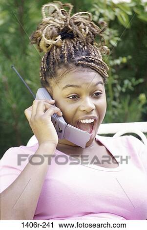 Stock Image - people, woman, telephone, talking, listening, conversation, excited. Fotosearch