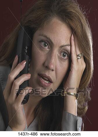Stock Photograph - people, woman, telephone, talking, phone, surprise, surprised. Fotosearch