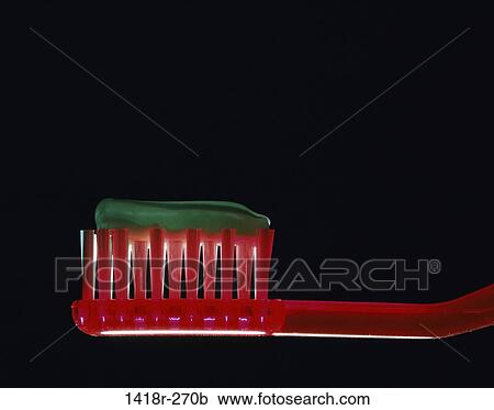 Stock Image - red, still life, toothbrush, toothpaste, hygiene, housewares. Fotosearch