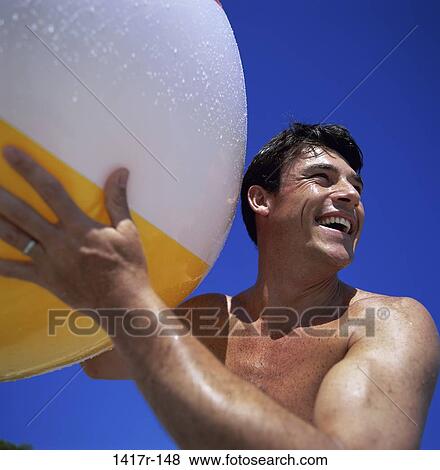 sky, people, Hispanic, blue, ball, beach View Large Photo Image Stock Photo - sky, people, Hispanic, blue, ball, beach. Fotosearch