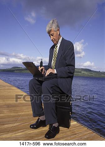 Stock Photograph - water, computer, laptop, business, outdoors, dock. Fotosearch
