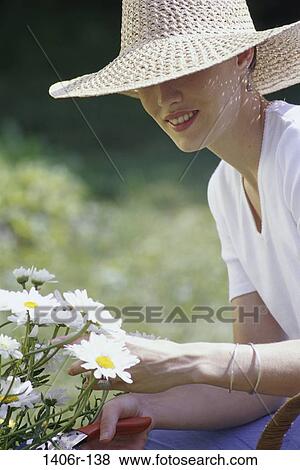 woman, hat, daisies, flowers, gardening, outdoors, garden View Large Photo Image Stock Photo - woman, hat, daisies, flowers, gardening, outdoors, garden. Fotosearch