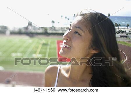 Field, people, woman, smiling, staring, Asian View Large Photo Image Stock Image - Field, people, woman, smiling, staring, Asian. Fotosearch