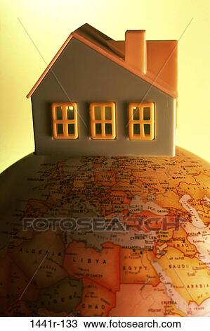 Stock Image - globe, house, toy, metaphor, Still lifes concept. Fotosearch