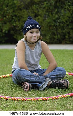 grass, people, smiling, hat, ground, sitting, girl View Large Photo Image Stock Photograph - grass, people, smiling, hat, ground, sitting, girl. Fotosearch