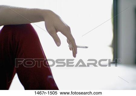 hand, cigarette, smoking, body part, social issue, Smoking cigarettes View Large Photo Image Stock Photography - hand, cigarette, smoking, body part, social issue, Smoking cigarettes. Fotosearch