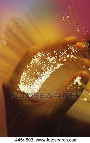 Stock Image - hand, industry, technology, bright, glowing, lights. Fotosearch