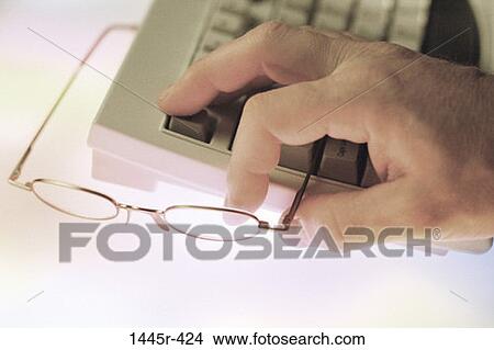 hand, keyboard, eyeglasses, computer, keys, buttons View Large Photo Image Picture - hand, keyboard, eyeglasses, computer, keys, buttons. Fotosearch