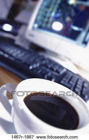 Stock Photo - keyboard, coffee, computer, coffee cup, still life, cup. Fotosearch