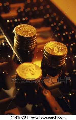 Picture - money, abacus, finance, still life, stack, coins. Fotosearch