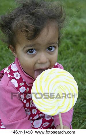 multiethnic, people, eating, licking, Hispanic, candy, girl View Large Photo Image Stock Photo - multiethnic, people, eating, licking, Hispanic, candy, girl. Fotosearch