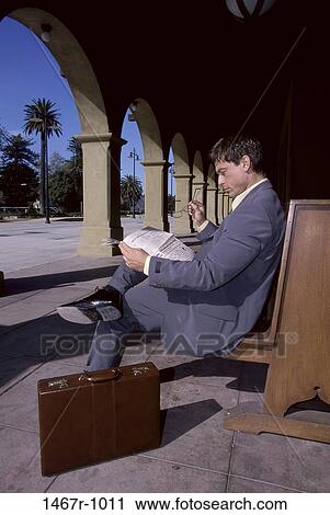 newspaper, briefcase, bench, sitting, reading, business View Large Photo Image Stock Image - newspaper, briefcase, bench, sitting, reading, business. Fotosearch