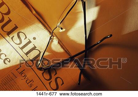 Stock Photo - newspaper, eyeglasses, business, still life, Business still lifes various. Fotosearch