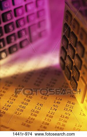 Picture - paper, calculator, business, finance, stock market, still life. Fotosearch