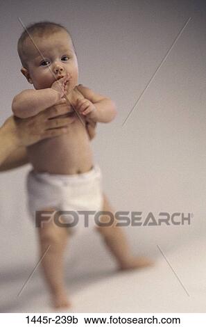 people, baby, holding, standing, stand, helping View Large Photo Image Stock Image - people, baby, holding, standing, stand, helping. Fotosearch