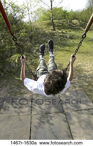 Stock Image - people, braces, swinging, swing, boy, outdoors, child. Fotosearch
