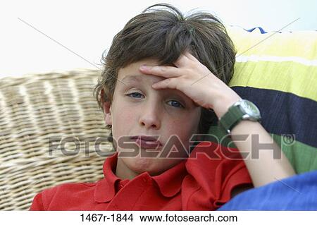 people, chair, sitting, boy, outdoors, propped View Large Photo Image Picture - people, chair, sitting, boy, outdoors, propped. Fotosearch