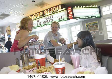 people, eating, french fries, drinking, flirting, beverages, booth View Large Photo Image Stock Image - people, eating, french fries, drinking, flirting, beverages, booth. Fotosearch