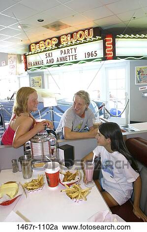 people, eating, smiling, talking, conversation, french fries, drinking View Large Photo Image Stock Image - people, eating, smiling, talking, conversation, french fries, drinking. Fotosearch