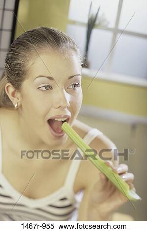 Stock Photography - people, eating, woman, diet, blond, food, hungry. Fotosearch